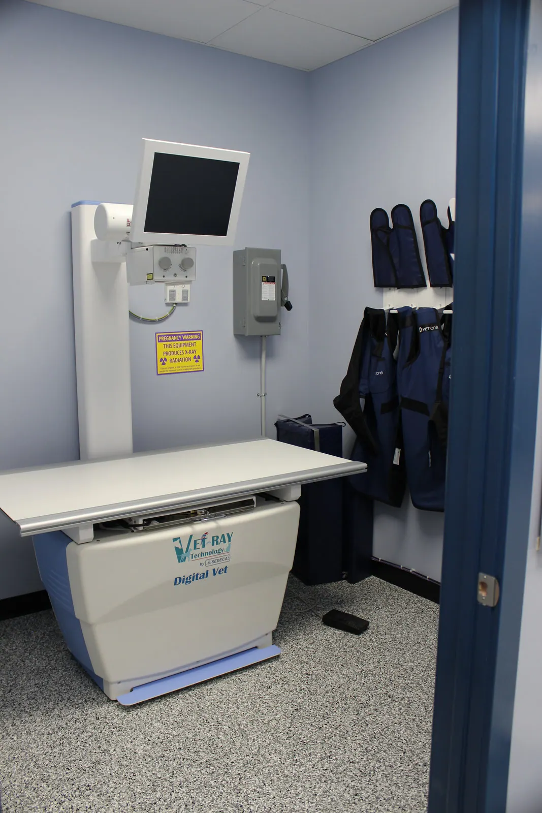 Digital x-ray room with Vet-Ray equipment and lead protective aprons